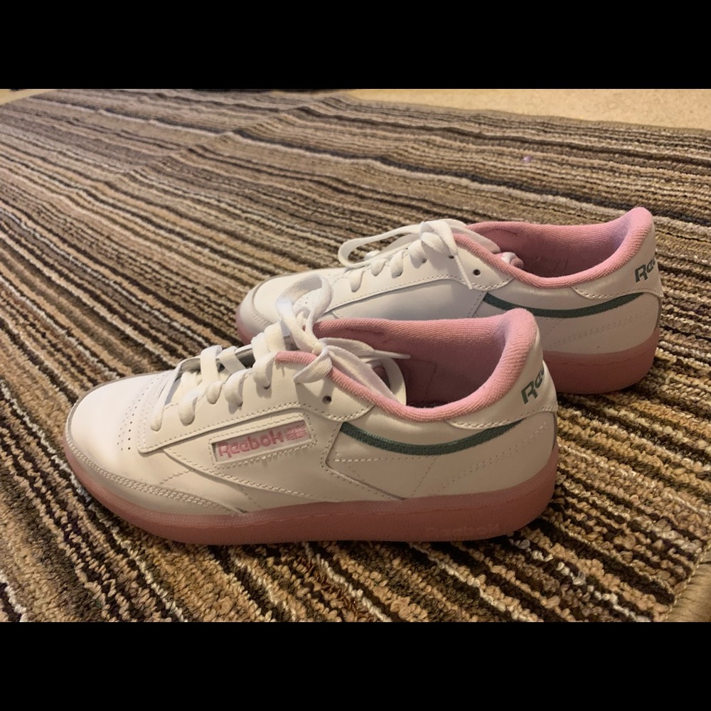 White and pink Reebok shoes